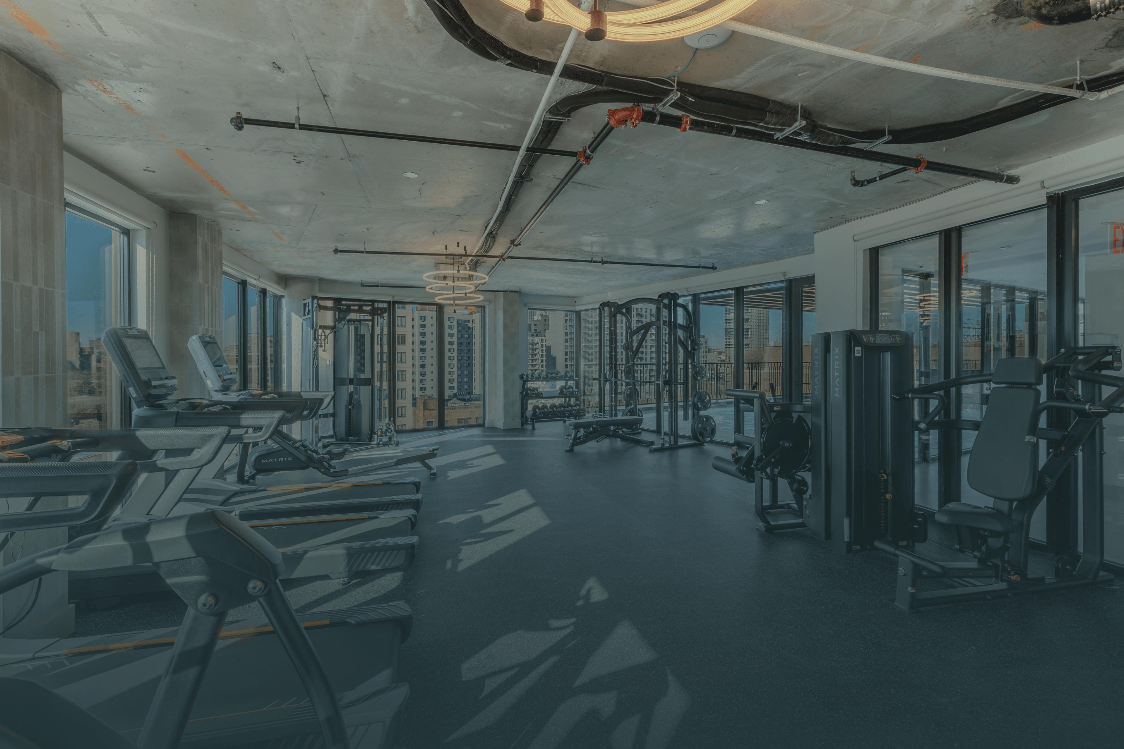 The fitness center at The Astelle, with cardio and strength equipment.