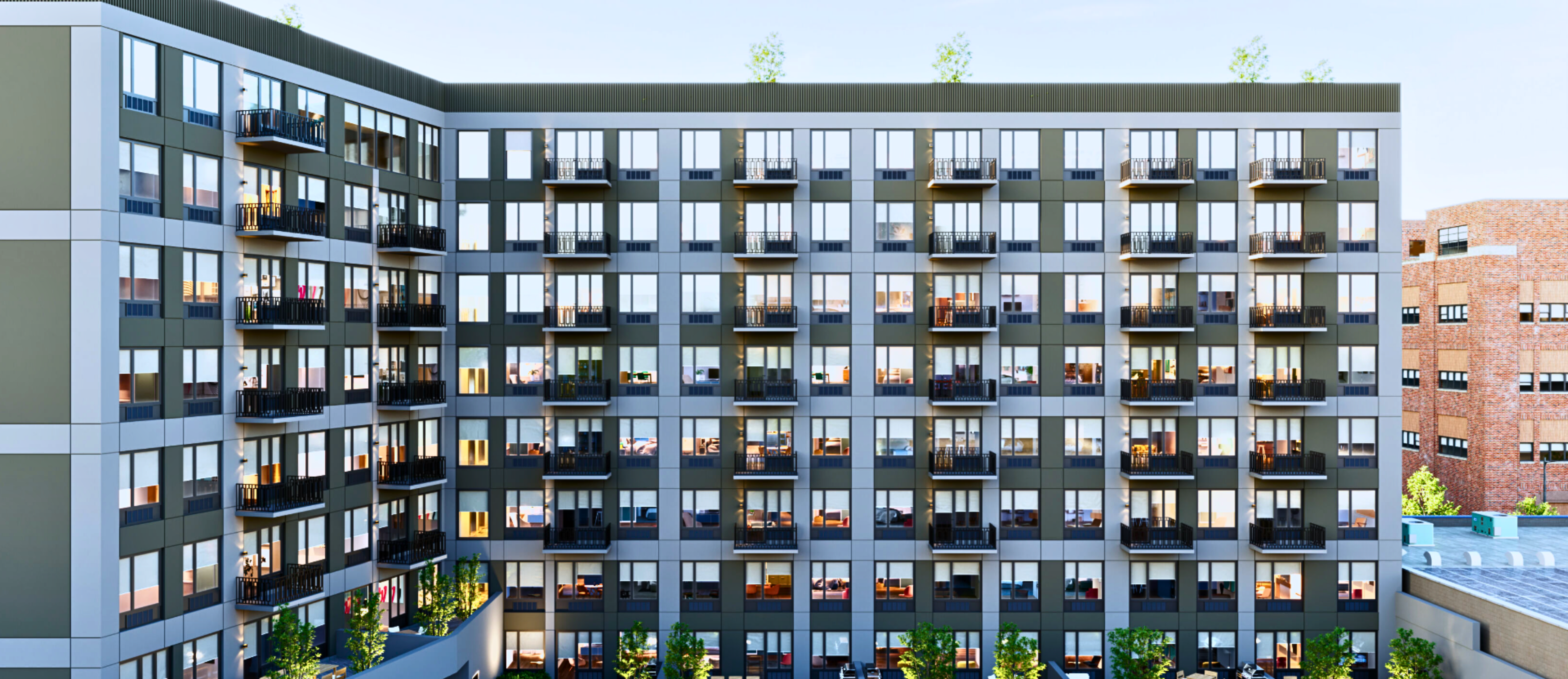 The full balconied exterior of The Astelle along Rider Avenue in Mott Haven